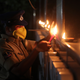 An Indian policewoman lights earthen lamps in Hyderabad.